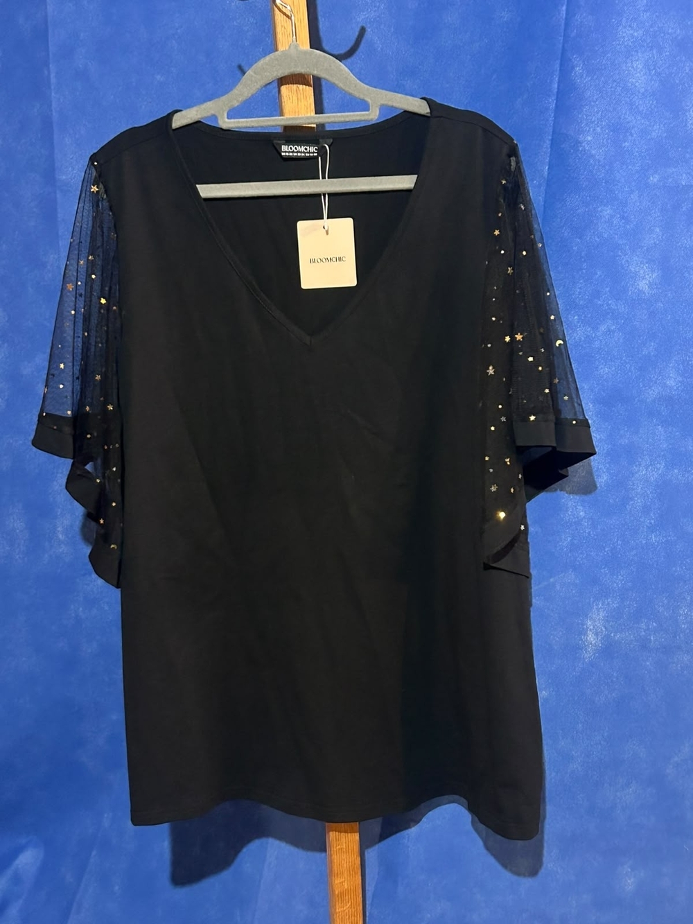 BloomChic Black V-Neck Top with Sheer Star-Embellished Sleeves